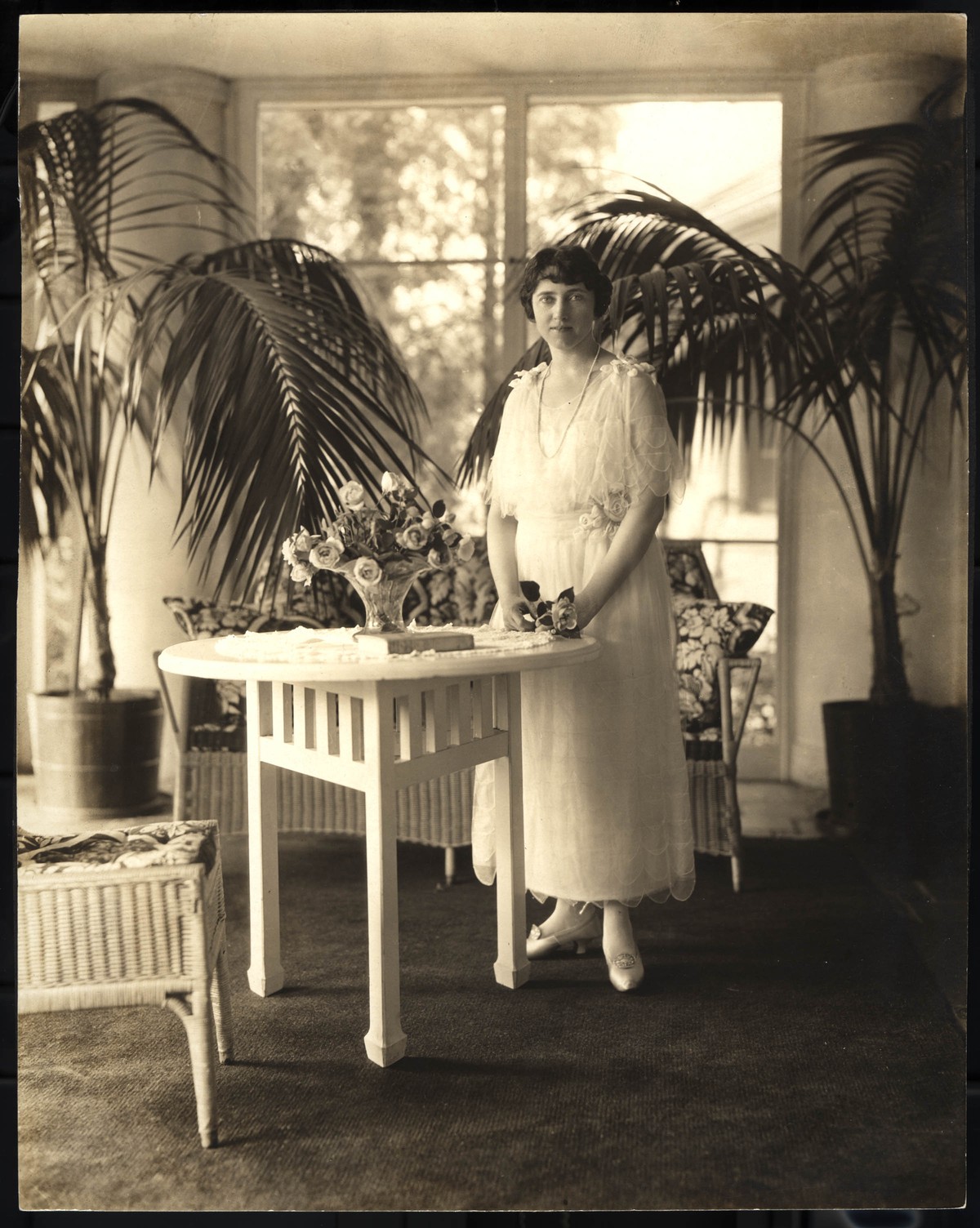 Katharine Reynolds standing inside of a sunroom 