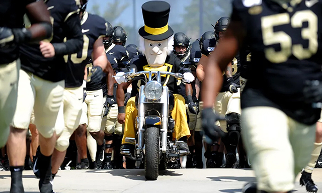 Deacon mascot on motorcycle