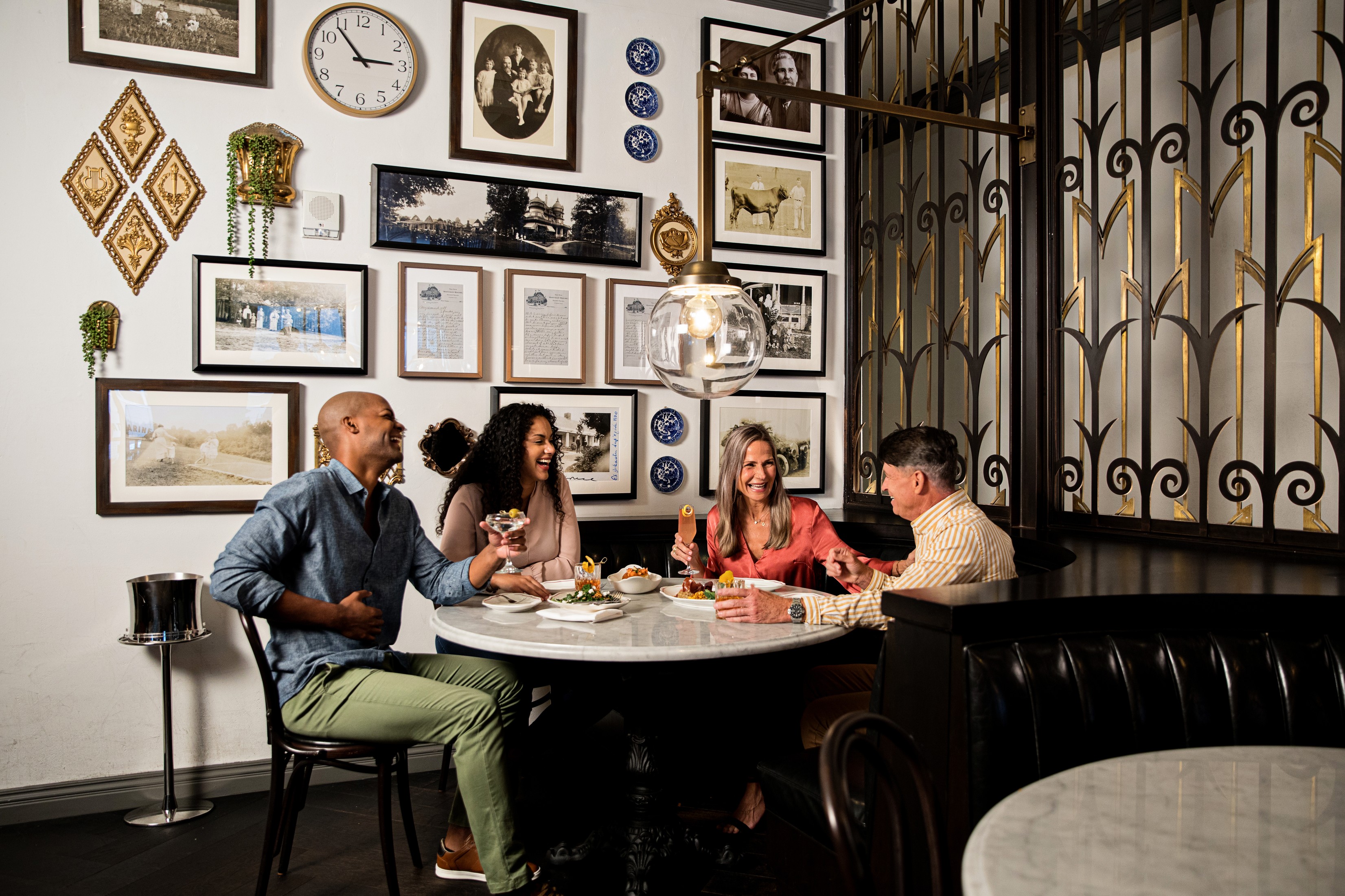 A group of four people dining at a restaurant