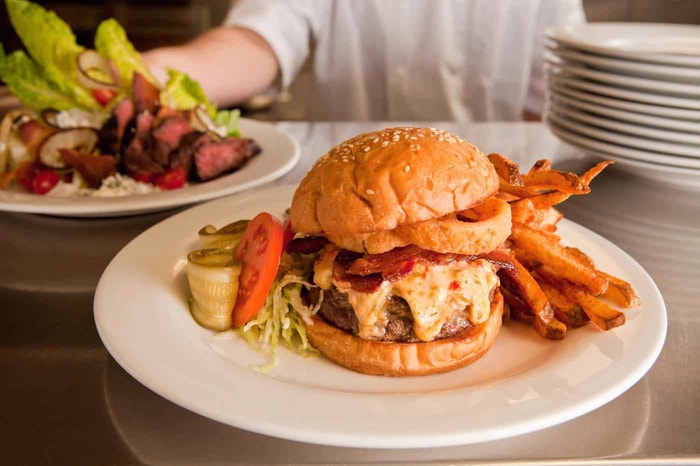 A cheeseburger with fries