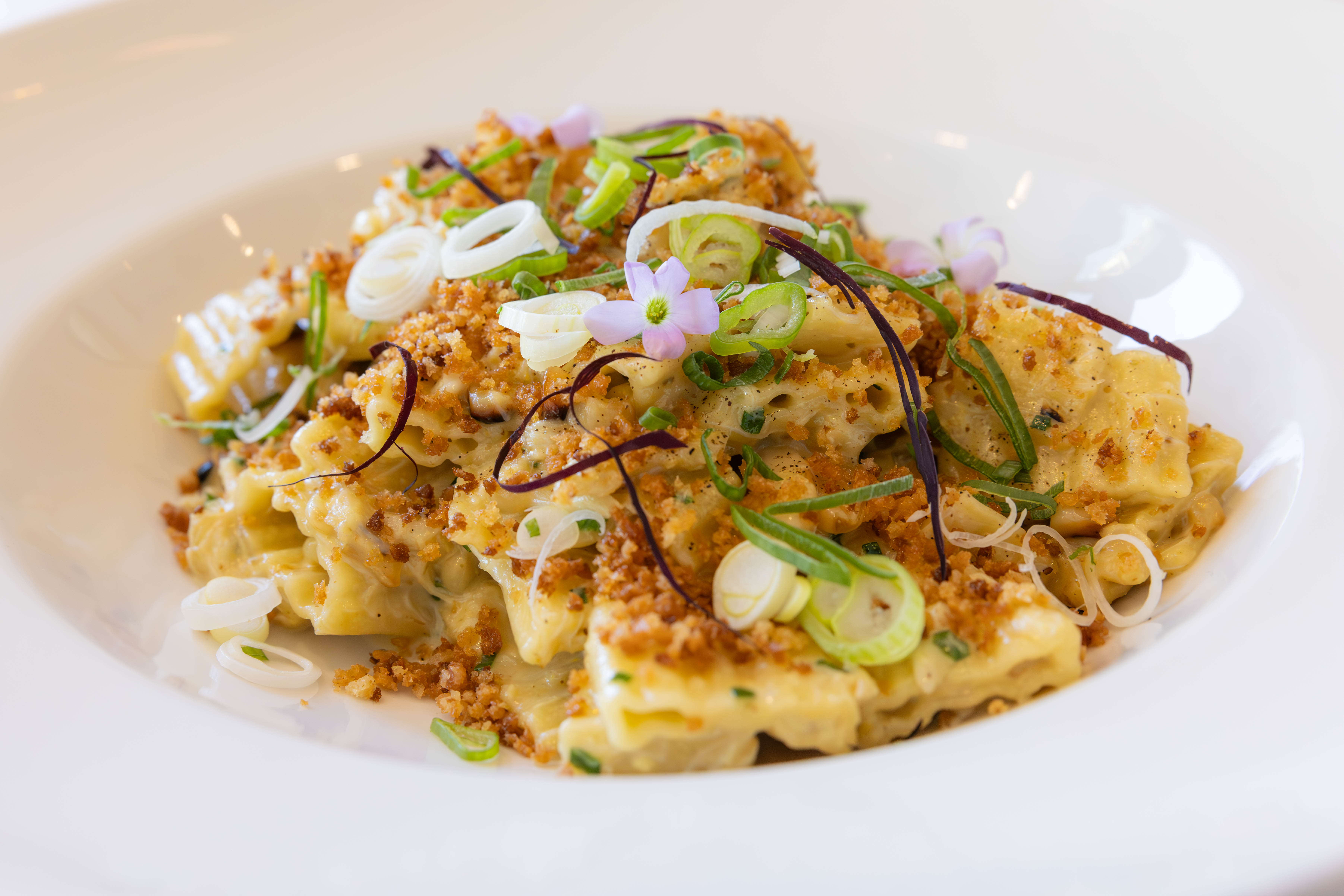 A white bowl of pasta with fresh crab meat from Downtown Grille in Winston-Salem