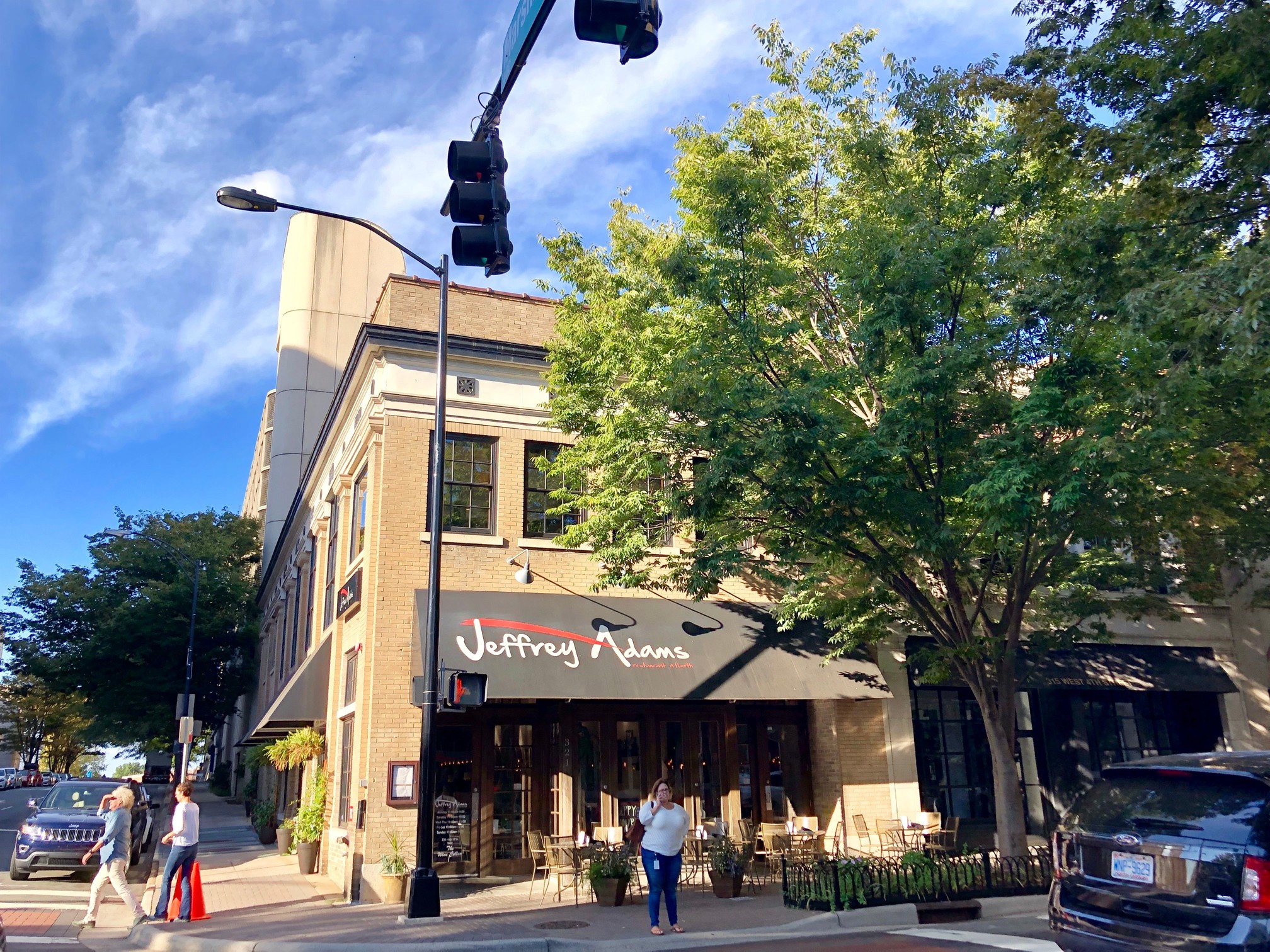 Exterior shot of the brick facade of Jeffrey Adams on Fourth, a restaurant in Downtown Winston-Salem