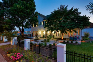 An exterior shot of Spring House restaurant at night