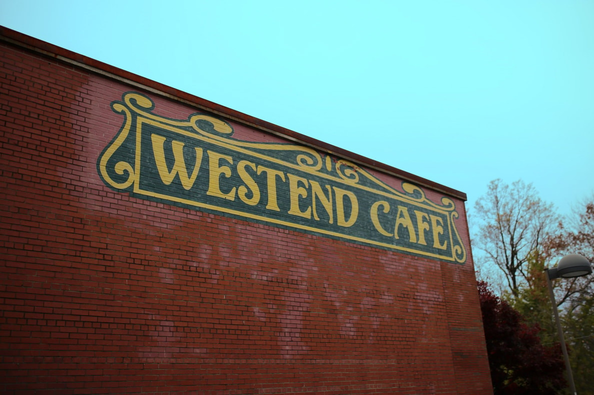 An exterior shot of a brick wall at West End Cafe in Winston-Salem, NC