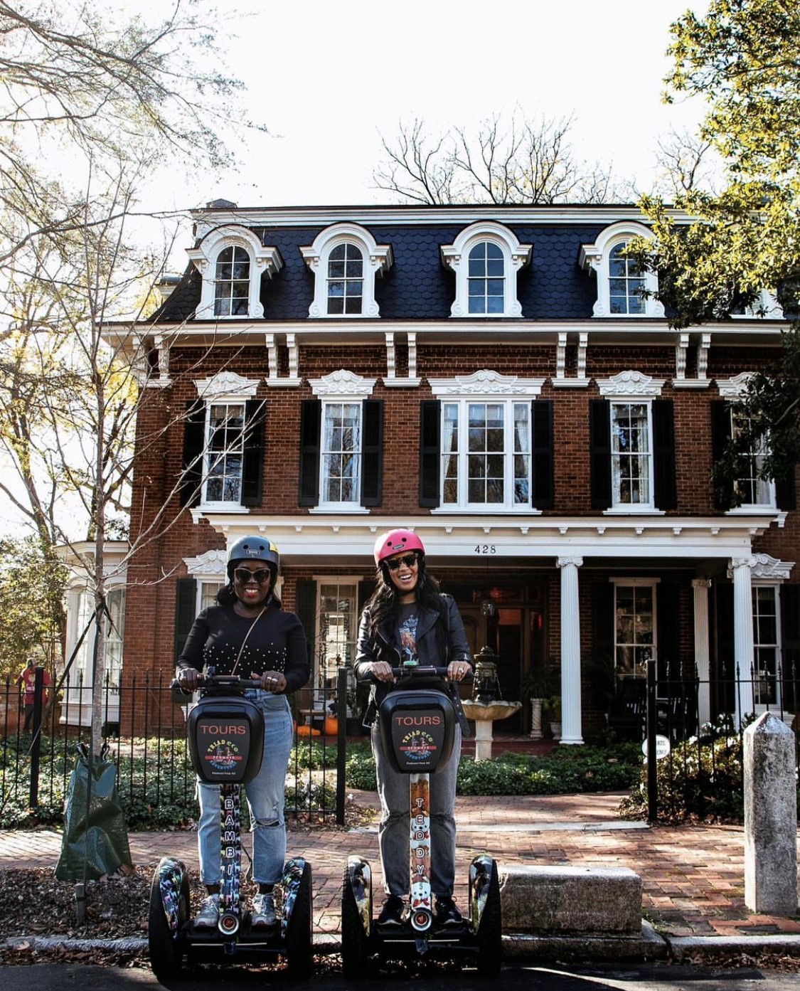 Two women posing for a photo on a segway tour