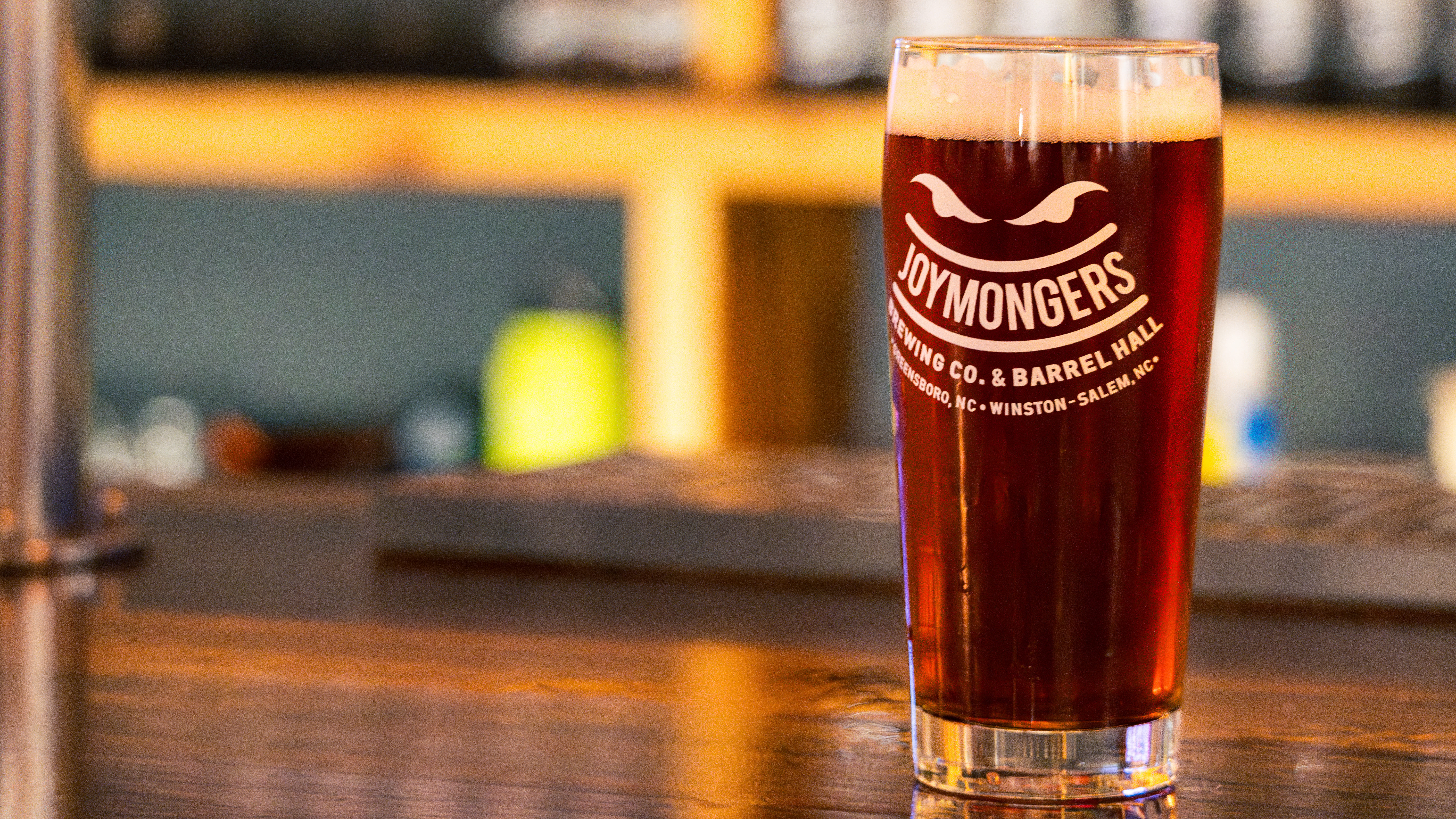 A pint of cold beer on the bar at Joymongers Barrel Hall in Winston-Salem.