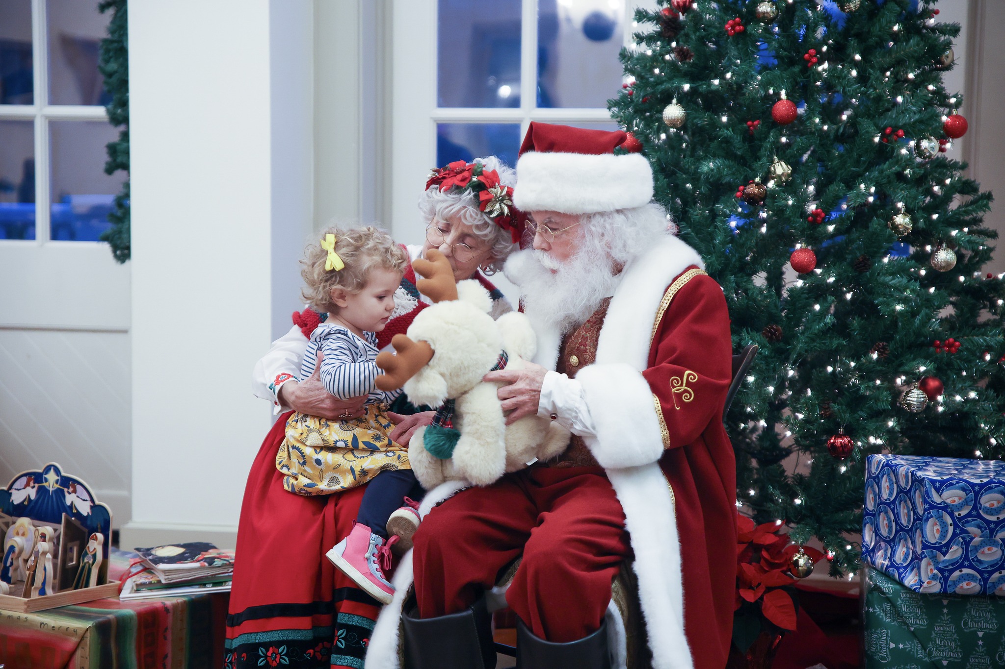 A child sits on Santa's lap at the Moravian ChristmasFest in Winston-Salem, North Carolina