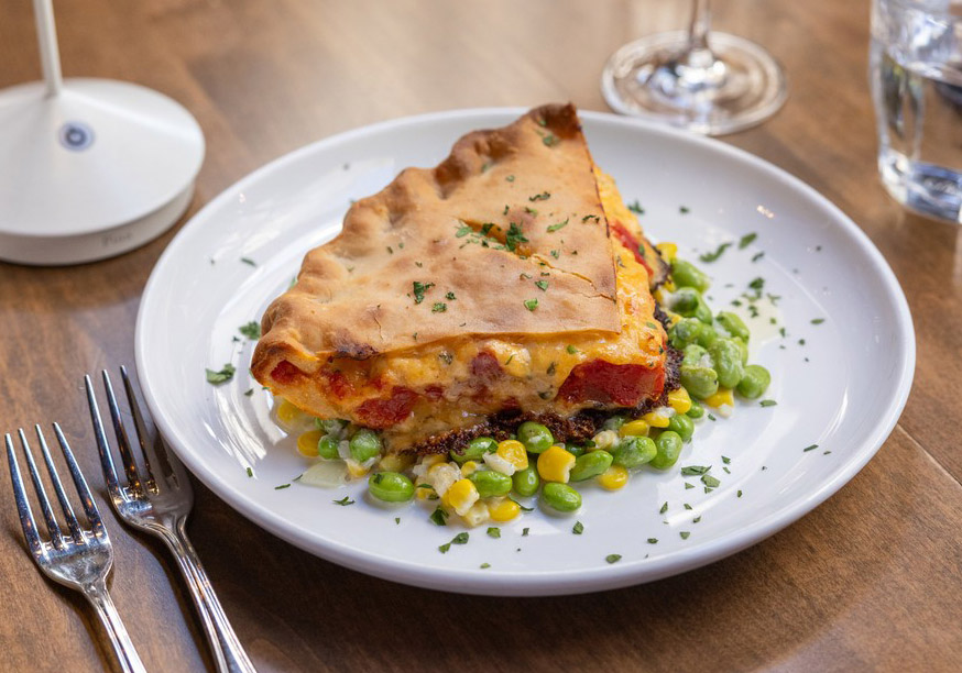 Mozelle's tomato pie on a white plate.