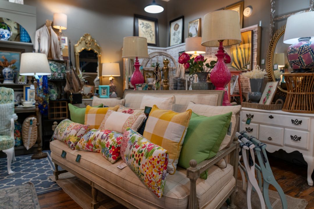 A store display including a sofa, pillows, and other housewares at Elizabeth's at Hanes Park in Winston-Salem.