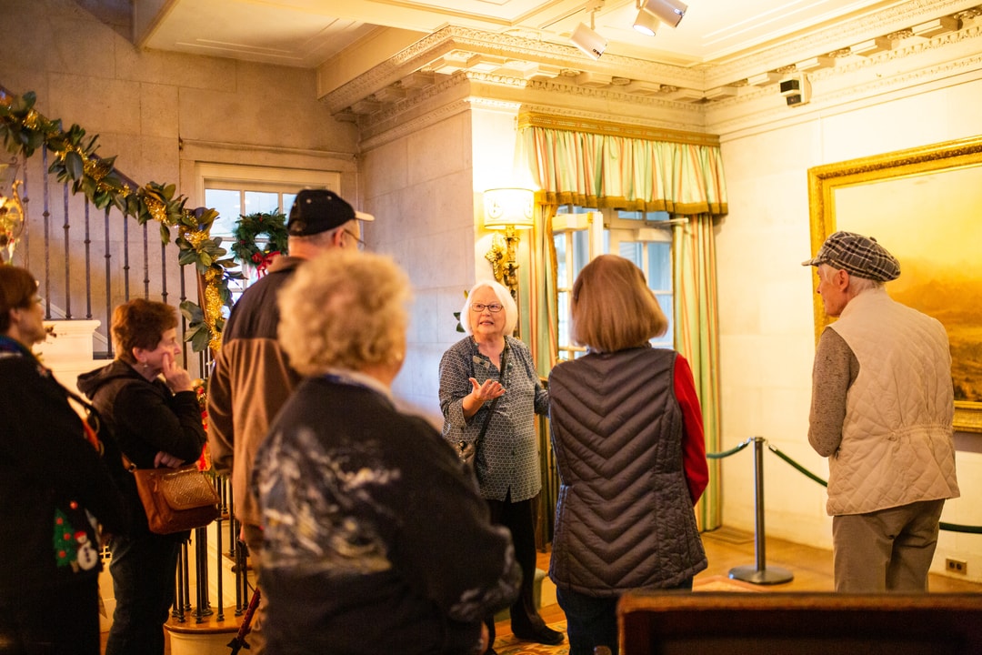 A docent leads a group through the Reynolda House Museum of American Art.