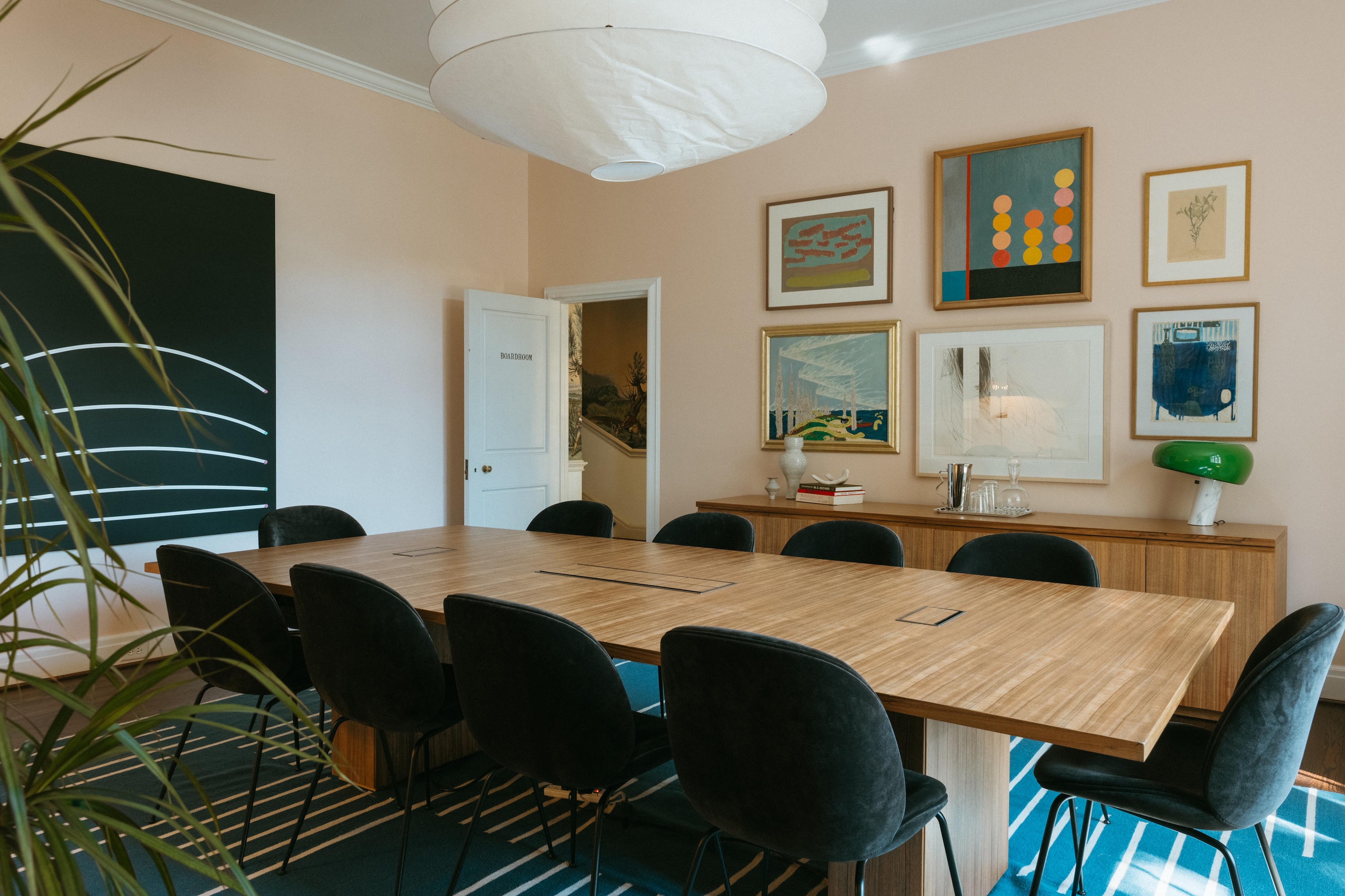 A boardroom set up for a meeting inside the Hanes House, located on the NCMA Winston-Salem campus.