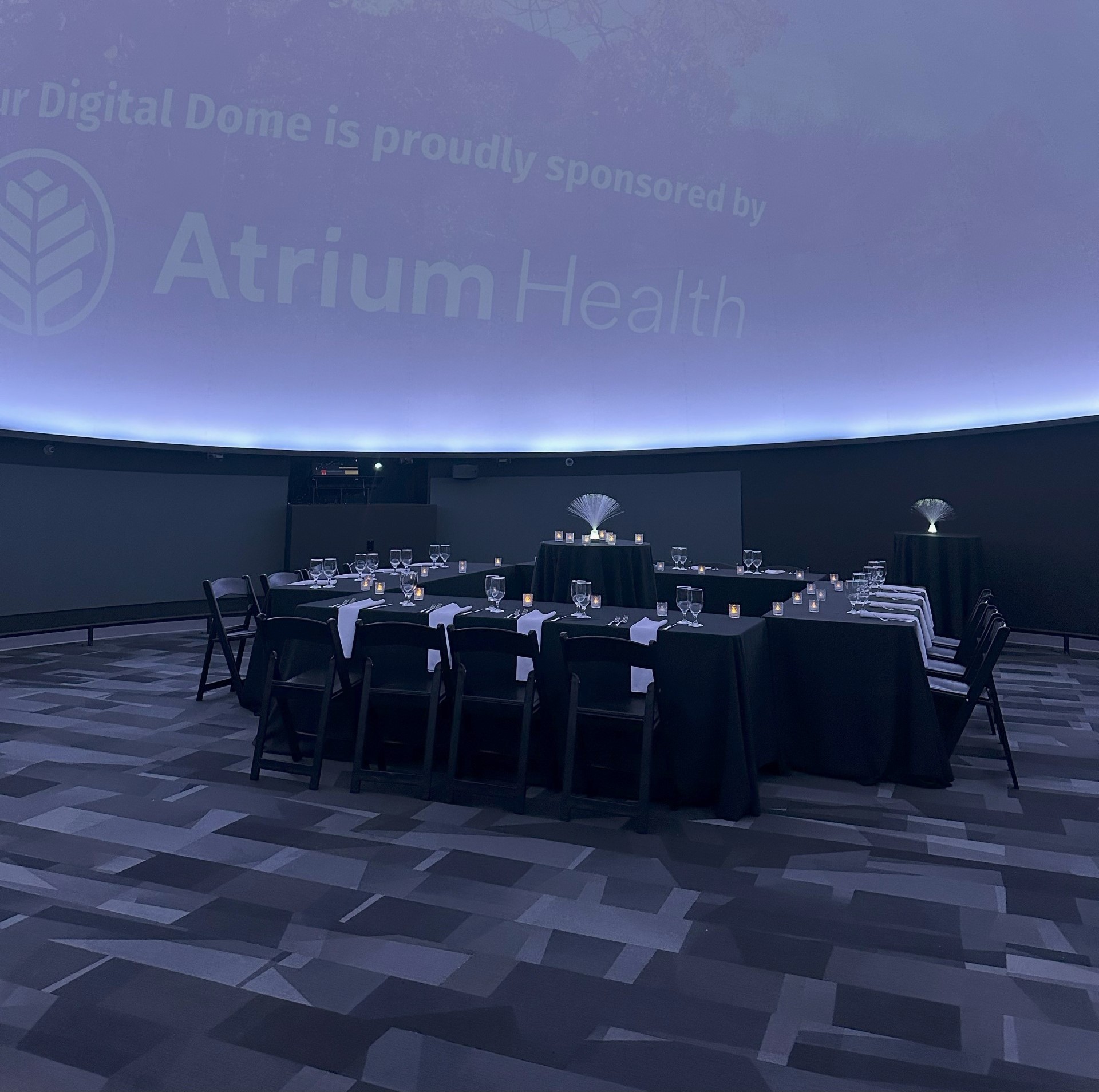 A corporate event set up inside the Digital Dome at Kaleideum Children's Museum.
