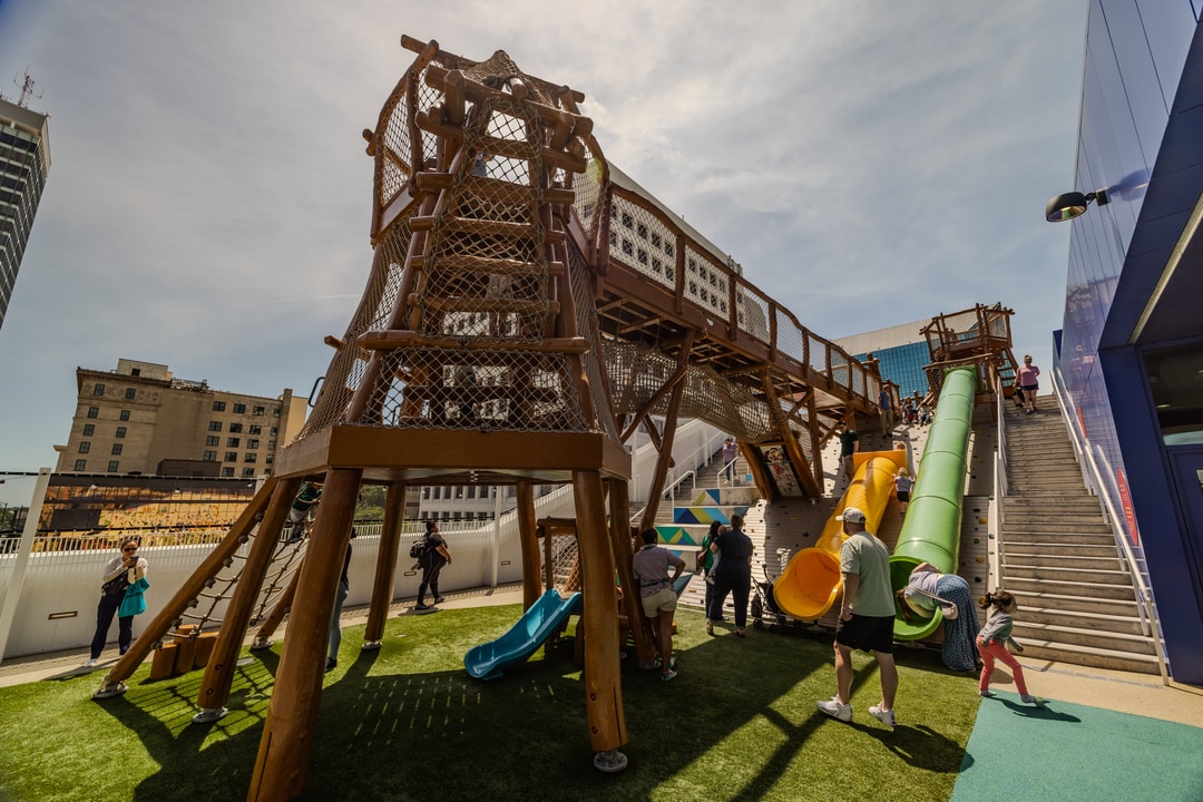 The rooftop playground at Kaleideum Children's Museum in downtown Winston-Salem, with the skyline in the background.