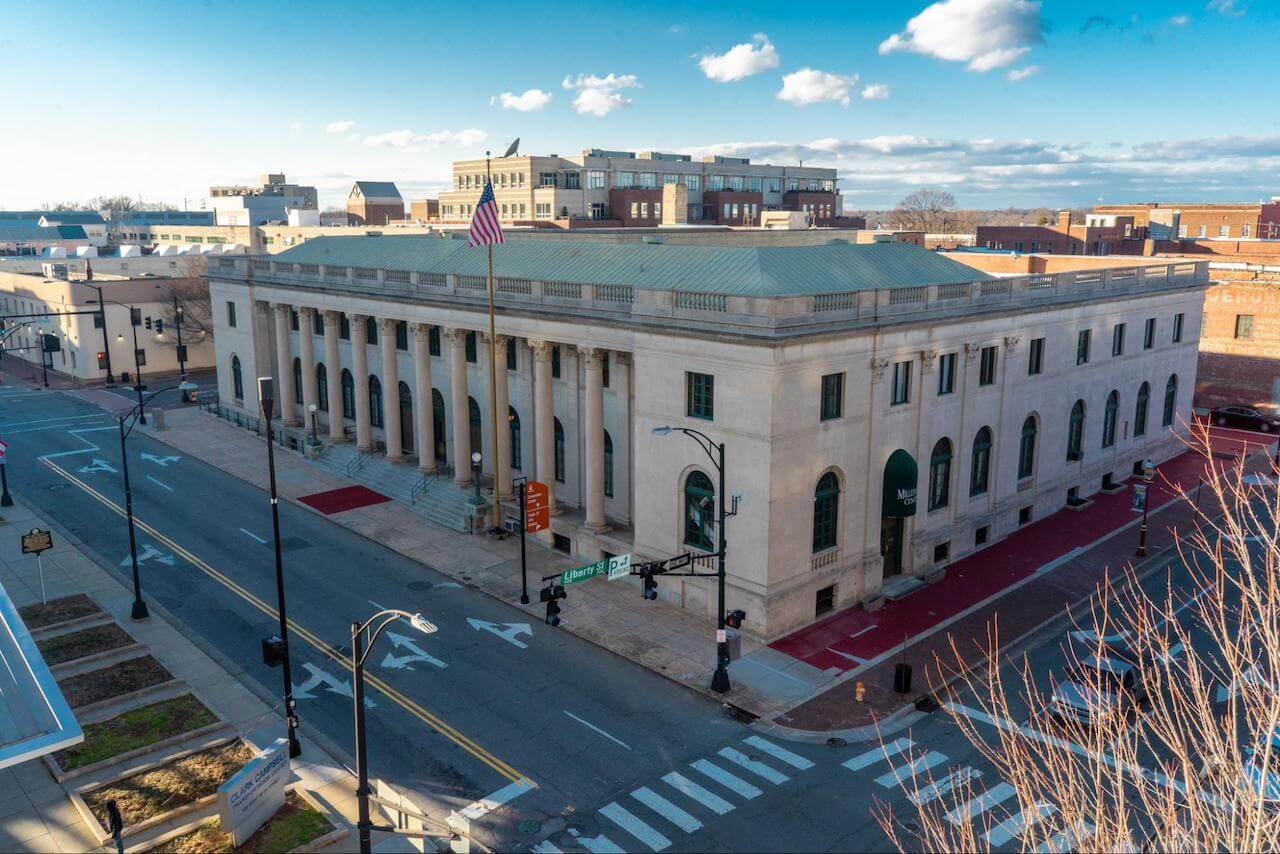 An aerial shot of the exterior facade of the Millennium Center in downtown Winston-Salem.