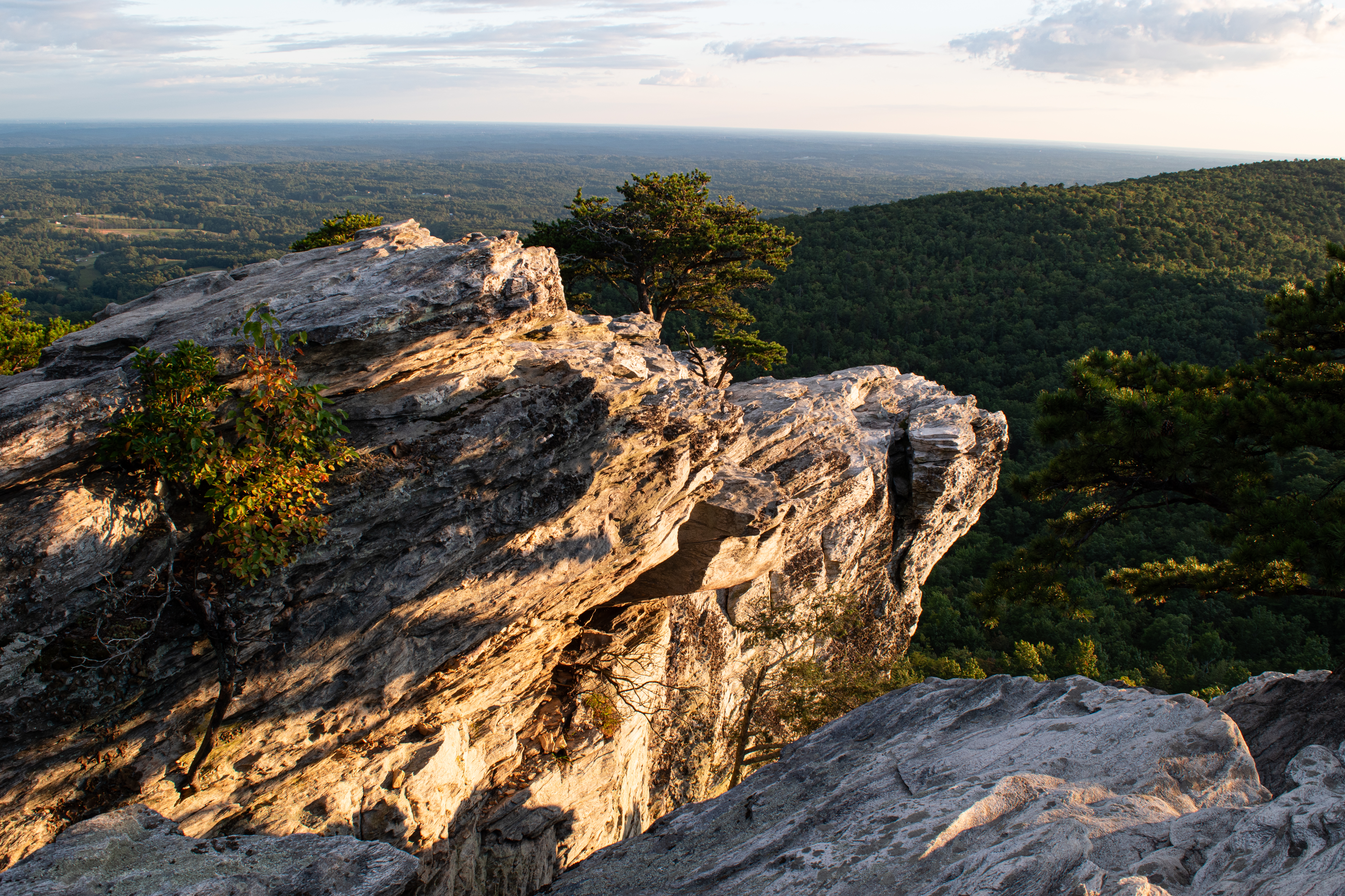 The sunset illuminates the namesake Hanging Rock formation and mountain range at Hanging Rock State Park