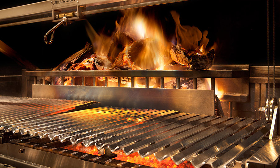 Wood burning grill inside the kitchen at Six Hundred Degrees restaurant in Winston-Salem