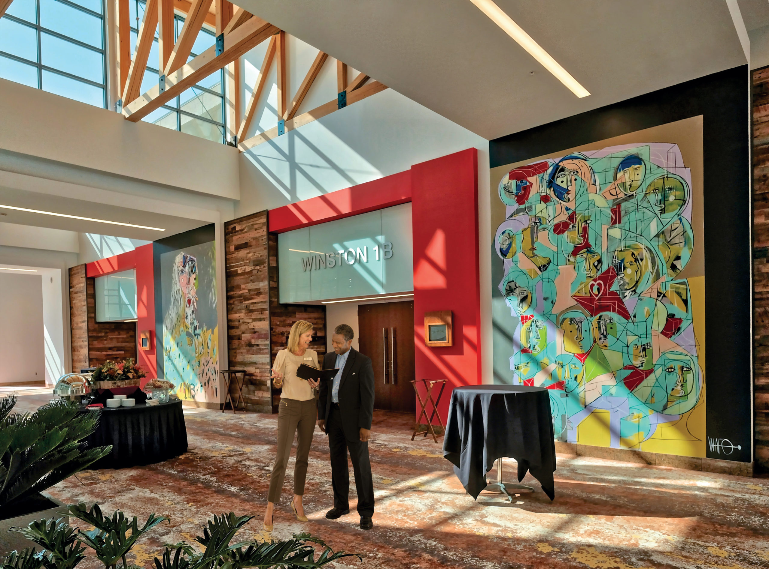 Two meeting planners having a discussion at the Benton Convention Center in Winston-Salem, North Carolina