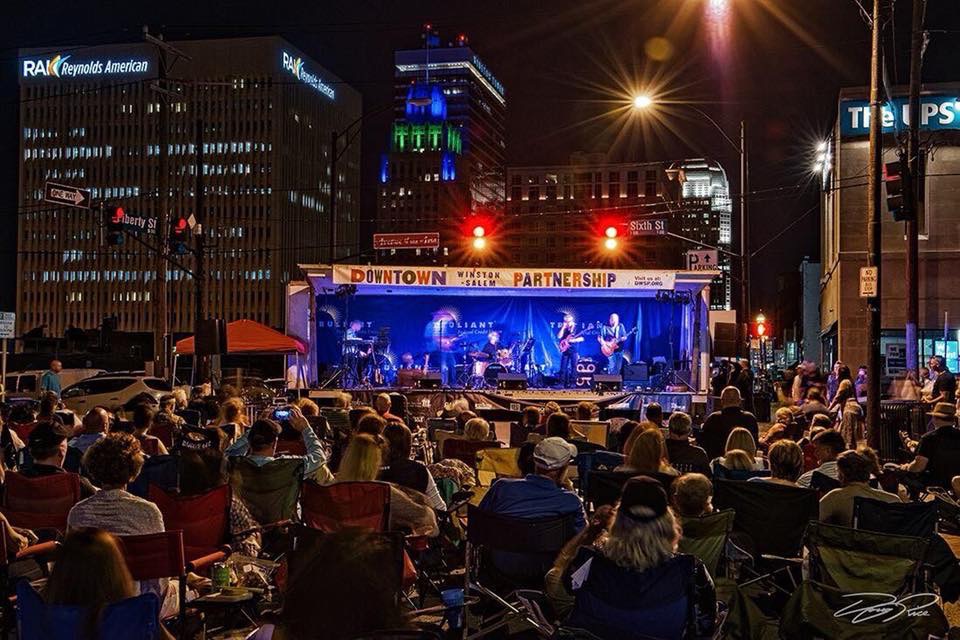 A live music show set up at the corner of Sixth & Liberty Streets in downtown Winston-Salem.