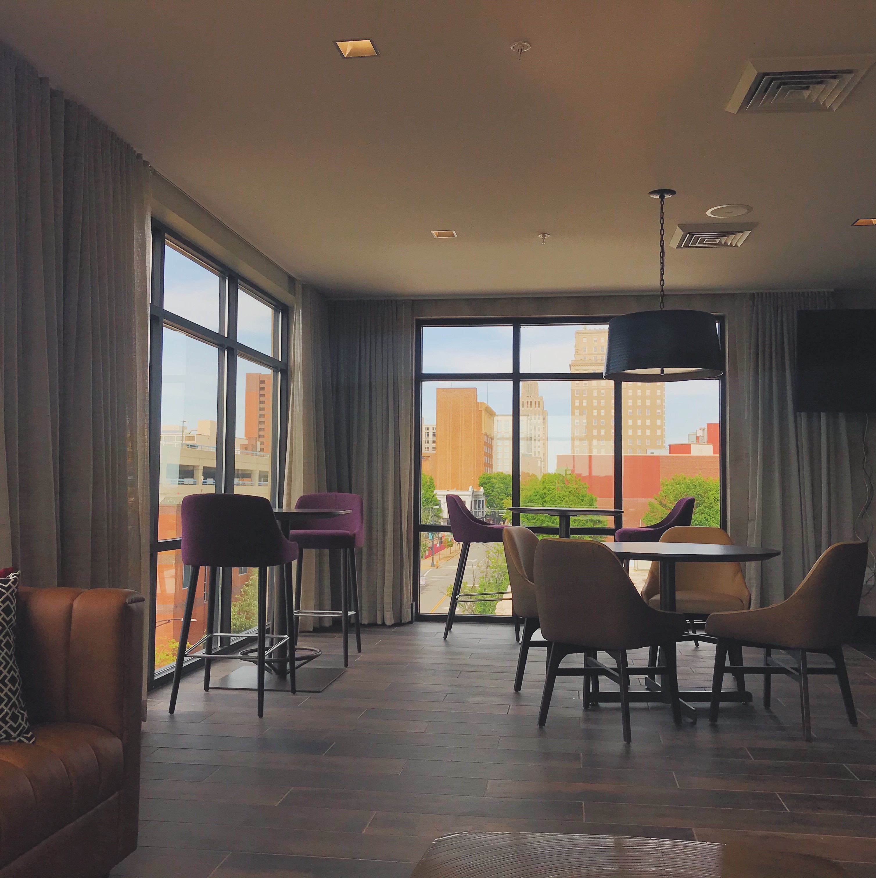 Our rooftop bar, Top of 4th, has an indoor area with floor to ceiling windows. Whether you’re sitting on the patio, or inside grabbing a drink at the bar, you won’t miss a second of this gorgeo... Photo