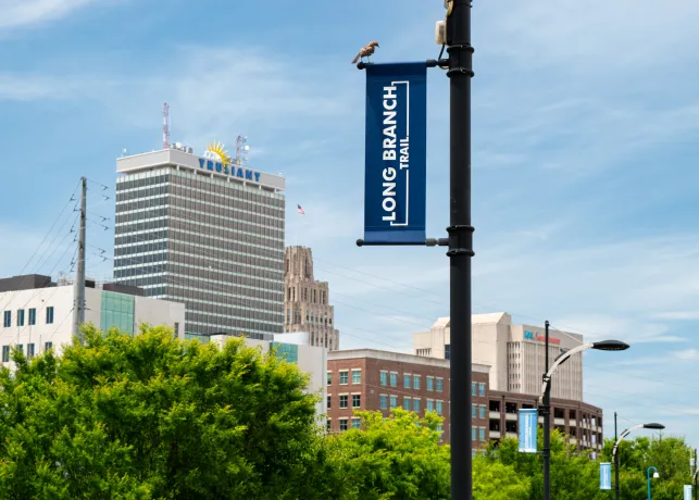 Long Branch Trail sign with skyline