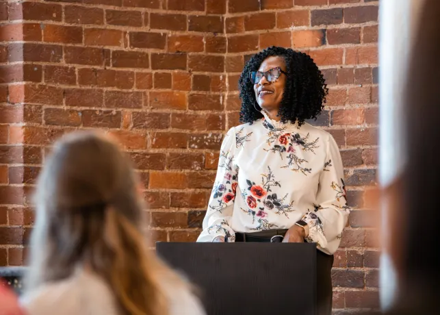 Brandy Evans- Visit Winston-Salem Chief Marketing Officer- addresses a group of hotel and community partners at a local PR forum.