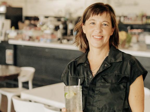 Claire Calvin, Winston-Salem restaurant owner, poses in front of the bar at her restaurant East of Texas.