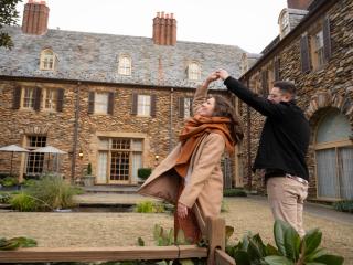 A couple dancing in the courtyard at the Graylyn Estate in Winston-Salem.