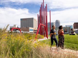 Two women walk through Artivity on the Green Park in downtown Winston-Salem, North Carolina