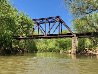 An old, steel bridge crosses over Mitchell Creek in the Yadkin Valley of North Carolina.