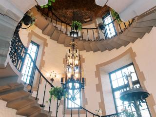 The grand staircase at The Gralyn Estate hotel in Winston-Salem.
