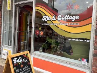 An exterior shot of Kin & Cottage, a home fragrance store located in Winston-Salem's downtown arts district.