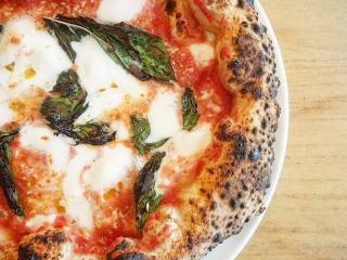 A classic margherita wood fired pizza at Mission Pizza Napoletana in Winston-Salem.