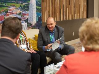 A group of meeting planners discussing meeting options at the Benton Convention Center in Winston-Salem, North Carolina
