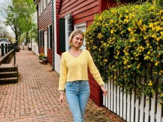 "Magnolia Megan", a North Carolina-based social media influencer, walks down Main Street at Old Salem Museum and Gardens.