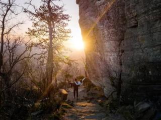 "The Capturing Couple", a Tampa-based social media influencer couple, pose in front of the sunset at Hanging Rock State Park.