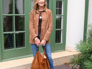 Suzanne Smith, also known as the face behind the lifestyle blog "Crazy Blonde Life", poses in front of the Reynolda House Museum of American Art in Winston-Salem.