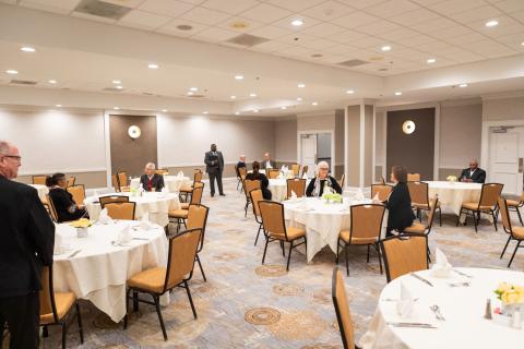 Room with chairs and tables at Benton Convention Center