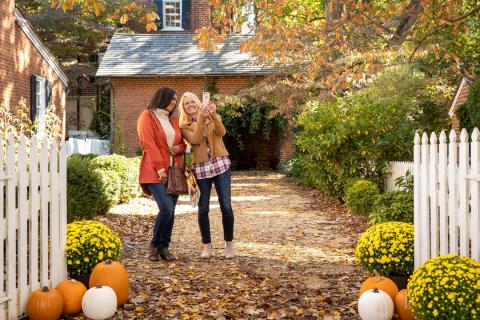 Two women standing together taking a selfie at Old Salem