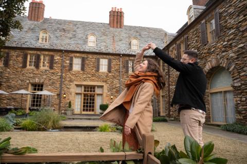 A male and female couple dances in front of the Graylyn Estate in Winston-Salem.