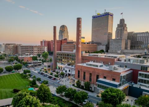 A panoramic view of the downtown Winston-Salem skyline at sunset, shot from Innovation Quarter.