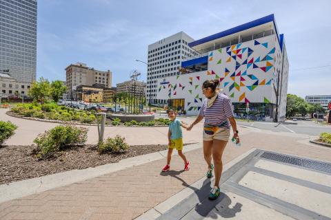 Kaleideum exterior with mother and child