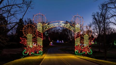 Gate with lights saying seasons greetings 
