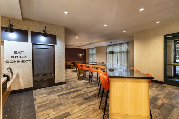 Our lobby offers plenty seating options for socializing or enjoying food and drinks with friends at The Bistro. Photo 23