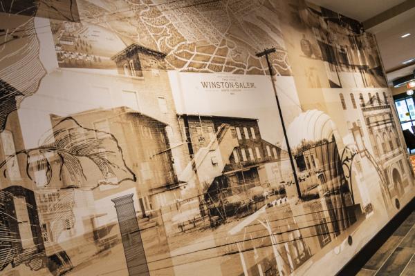 Hotel design features wallpaper incorporating the history of Winston-Salem. Photo 25