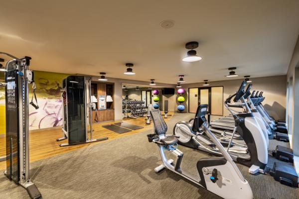 Open 24/7, our fitness center comes complete with cardio & assisted weight machines, medicine balls, dumbbells and yoga mates. Photo 27