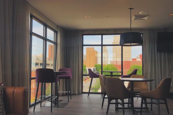 Our rooftop bar, Top of 4th, has an indoor area with floor to ceiling windows. Whether you’re sitting on the patio, or inside grabbing a drink at the bar, you won’t miss a second of this gorgeo... Photo