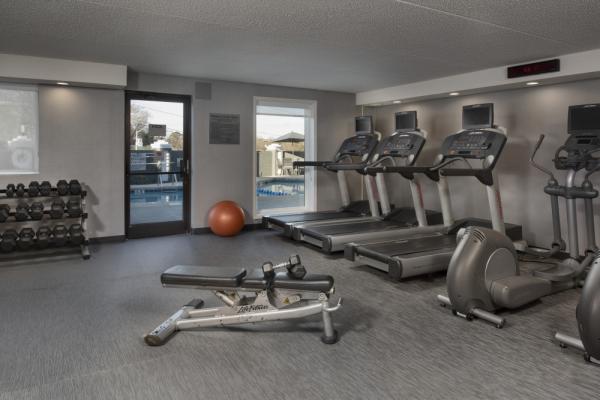 Maintain your normal workout routine in our 24 hour state of the art Fitness Center. Stay energized with a variety of cardio equipment and our free weight system. It is the perfect way to kick star... Photo 8