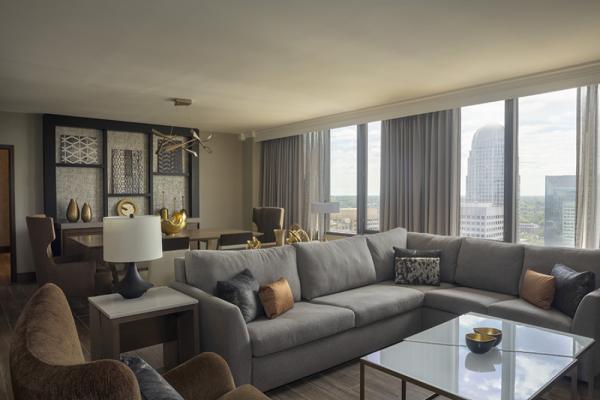 Our all new Presidential Suite offers a luxurious experience with breathtaking views of downtown Winston-Salem. The 750 sq. ft. parlor includes table seating for 6, separate kitchen, 60" mounted an... Photo 5