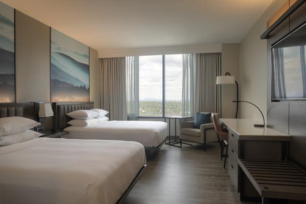 All new 375 s.f. guest rooms feature 55" mounted TV's, complimentary Wi-Fi, laminate flooring, accent lighting, bathrooms with perimeter lighting, barn style sliding doors and 80% of guest rooms wi... Photo 6