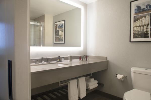 All new guest room bathrooms feature perimeter lighting, barn style sliding doors and 80% of guest rooms with walk-in showers Photo 8